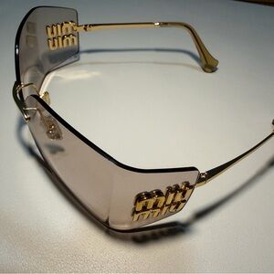 Miu Miu Sunglasses with Gold Accents and Brown Tint!